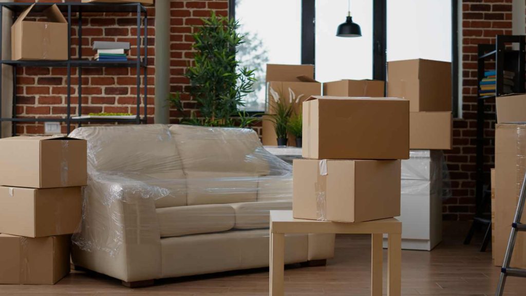 no-people-living-room-interior-move-with-carton-boxes-empty-real-estate-property-full-cardboard-packing-storage-cargo-nobody-apartment-relocation-moving-day