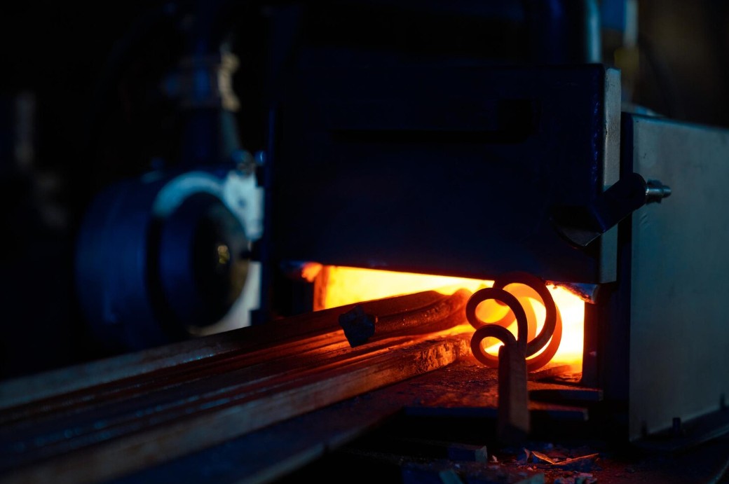 iron heating inside forge furnace burning fire
